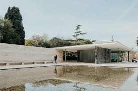 The Barcelona Pavilion By Ludwig Mies Van Der Rohe Is A Textural Delight Ignant Barcelona Pavilion Pavilion Architecture Water Pavilion