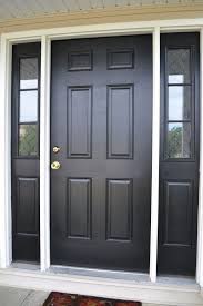 This contemporary front door features opaque, fully glazed sidelights and subtle chrome finishes. 7 Amazing Black Front Door Ideas Frontdoor Frontdoorideas Black Blackfrontdoor Doo Painted Front Doors Black Exterior Doors Exterior Doors With Sidelights