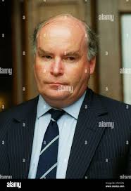 Gerald Corbett, Chief Executive of Railtrack, flanked by Richard Middleton,  Commercial Director, (left) and Jonson Cox, Operations Director, making a  statement this evening outside the Railtrack office in London Stock Photo -