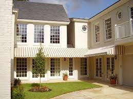 Marygrove Awnings Drop Arm Shades Add Decor To Your Home These Awnings Significantly Cool Room Temperature And P Residential Awnings Awning Canopy Residential