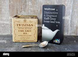 Twinings Earl Grey Vintage Tea Caddy And Spoon With Packet Of Waitrose Loose Leaf Tea Against Wooden Background Stock Photo Alamy