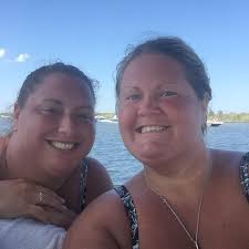 What is the best way to get to Universal City from All Star Music and how  much does it cost for 2 adults?