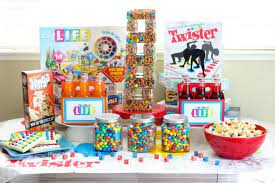 Starting with a base of primary colored party decorations can help to inexpensively fill in the space not decorated by games themselves and save money on tableware. How To Host The Best Game Night Party Gluesticks Blog
