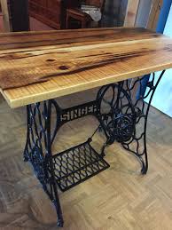 End Table Made From Antique Singer Sewing Machine With Rough Sawed Lumber Used As Top Antique Sewing Machine Table Sewing Table Antique Sewing Table