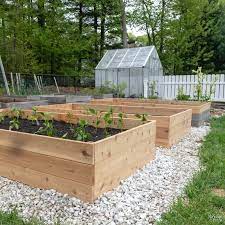 Today i'm sharing all of the details on how i built the elevated cedar planter, what we put in it, and how i plan to have jackson help me take care of it. How To Build A Raised Garden Bed The Navage Patch