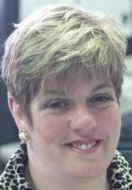 Woman charged with theft from manufacturer