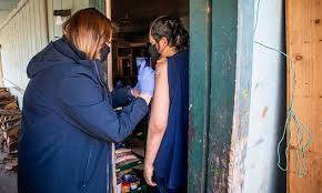 A medical assistant explains the vaccination procedure to a member of the white mountain apache tribe at a vaccination event inside whiteriver's gymnasium on feb. How The White Mountain Apache Tribe Beat Covid Yes Magazine