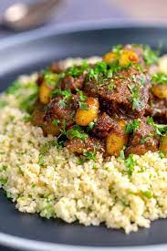 Reduce heat, cover, and simmer, stirring occasionally, until lamb is tender when pierced, about 1 hour. Moroccan Lamb Tagine With Dates Almonds Krumpli