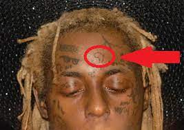 This is primarily because he is constantly adding to his here's an overview of lil wayne's tattoo designs. Lil Wayne Shows Off New Africa Pride Continent Tattoo On His Forehead At Halloween Party