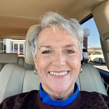 This is a vintage, hand-painted "Gone With the Wind" style hurricane or  parlor lamp, featuring a floral design