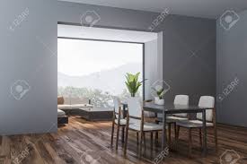 This dining room from revivalhomedesigns features benjamin moore's steep cliff gray, a medium gray with blue undertones. Corner Of Modern Dining Room And Living Room With Gray Walls Stock Photo Picture And Royalty Free Image Image 128412935