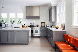 The warmth of the wood floor gives contrast to the otherwise neutral color palette. 8 Gray Kitchens That Nail Warmth And Balance The Studio Patrick Design Center