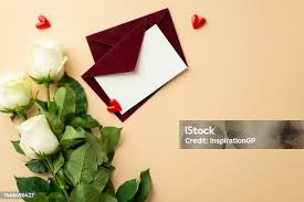 Photo Album And Dry Red Roses On Coffee Seeds Stock Photo