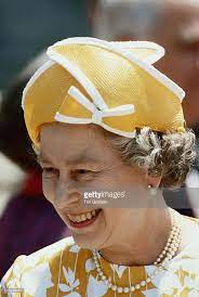 Queen Elizabeth Ii Wearing A Yellow Hat With White Trim Designed By Queen Elizabeth Queen Hat Her Majesty The Queen