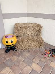 House porch decorated for halloween. Fall Decorating Idea Using Hay Bales Fall Front Porch Decor