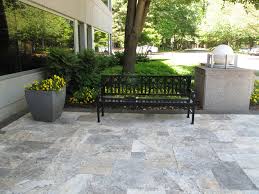 Precast concrete slabs in an assortment of colours, sizes, and shapes provide easy installation for walkways, patios, curbs, and edgers. 24x24 Silver Travertine Paver