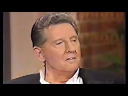 Jerry Lee Lewis hears a recording of himself singing Merle Haggard’s “I  Threw Away The Rose.”