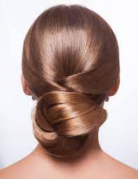 Girls with curly hair will love this cute bun. 50 Stunning Bun Hairstyles You Need To Check Out Now
