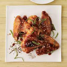 Up your chicken wings with a homemade marinade and dry rub! Spicy Sriracha Chicken Wings Recipe Michael Symon Food Wine