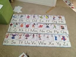 Great way to help your kids build a foundation for learning and spelling skills. Disney Alphabet Line Some Diy Involved Disney Alphabet Alphabet Line Disney Themed Classroom