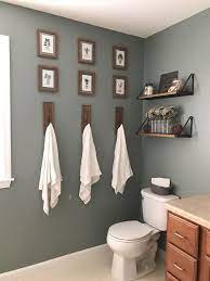A small space doesn't have to look cluttered or feel cramped when you don't shy away from including a freestanding bath in a small bathroom. Benjamin Moore Rushing River Magnolia 27 Inspirational Bathroom Color Ideas Bathroom Navyblue Bathroomdeco Bathroom Color House Bathroom Bathroom Decor