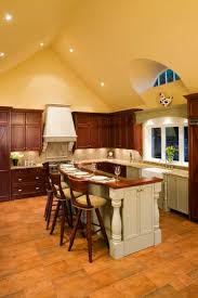 The kitchen, dining room and living room are beautifully distinguished by placing large jute chenille rugs in the center of each area while wood is used as a common material in the three spaces to merge them cohesively. 30 Kitchens With Two Tier Islands Nice Feature Home Stratosphere