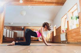The purpose of cat/cow is to mobilize the spine and pelvis & retrain spinal movement patterns. Young Attractive Woman Practicing Yoga Doing Asana Paired With Stock Photo Picture And Royalty Free Image Image 120790907