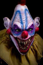 Angry ugly clown wants to kill a balloon in a cap on a black background. Pin On Nightmares