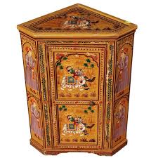 Corner cabinets are one of the most popular pieces of furniture present in modern households. New Delhi Hand Painted Mango Wood Mini Corner Cabinet