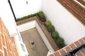 A window well is helpful in that it allows light and air into an otherwise dark and dank space, but it often lets in. Pin On Basement Lightwell Ideas