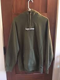 Featuring a boxy fit, a drawstring hood, long sleeves, a front logo patch, a kangaroo pocket and a ribbed hem and cuffs. Supreme Supreme Olive Green Box Logo Hoodie Grailed