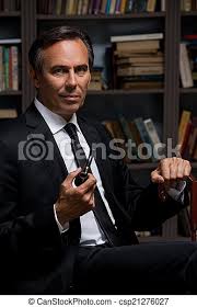 He does the right thing, even if the right thing does not seem the popular thing. Confident Gentleman Confident Mature Man In Formalwear Holding Pipe And Cane While Sitting Against Bookshelf Canstock