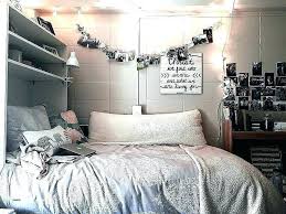 Rather minimalist room decor with some textiles and wall art pieces. Dorm Rooms Dorm Room Wall Art Ideas