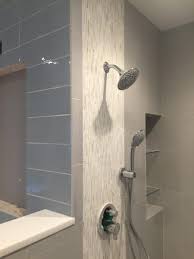 Shower Wall With Vertical Accent Strip Of Akdo Heavy Rain Calacatta Niche Box With Glass Shelves Shower Wall Options Shower Wall Bathroom Renovation