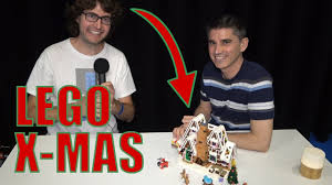 •the gingerbread house features frosted roofs with colorful candy buttons, a rich facade with candy cane columns and walking sticks, glittery windows and a tall chimney stack with a glowing fireplace. Lego Creator Expert 10267 Gingerbread House Designer Interview Youtube