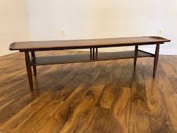 Tapered legs and rich walnut wood grain finish the look for a simple, elegant piece. Sold Mid Century Walnut Surfboard Coffee Table Modern To Vintage