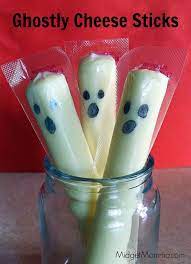 Ghost Cheese Sticks Super Easy Halloween Snack Treat That Kids Will Find Fun And Mom Can Do In Less Creepy Halloween Party Ghost Treats Easy Halloween Snacks