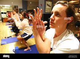 Maggie Devitt holds an intense position during a yoga class at the Pottruck  Health and Fitness Center, in Philadelphia, Pennsylvania, January 30, 2008.  (Photo by David M. Warren/Philadelphia Inquirer/MCT/Sipa USA Stock Photo -
