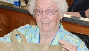 MTSU Alumni Association presents alumni employees with original horseshoe  print from alumna artist