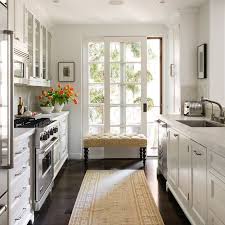 Use these remodeling ideas for a galley kitchen makeover that will add space and if your small kitchen is getting you down, a galley kitchen makeover is probably next on your home a galley kitchen is a long, narrow kitchen that resembles a hallway lined with cabinets. Orange Tulips Bowl Of Limes Small Galley Kitchens Kitchen Remodel Small Budget Kitchen Remodel