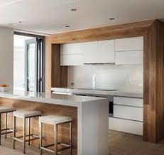 Following the latest design trends of minimalist simplicity, today's modern kitchens focus on open plan living, accented with clear lines and minimal clutter. Cuisinartcpm950bkpopcornmadecidenow Modern White Kitchen Designs With Timber