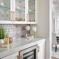 An interesting choice for a coffee nook, bar or bathroom backsplash, small mirrors reflect light to enlarge a space. 17 Home Bar Ideas