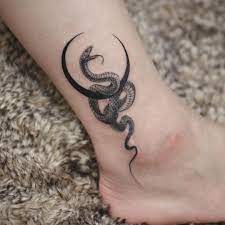 The Coolest Crescent Moon Tattoos And What They Mean In 2021 Tattoos Snake Tattoo Design Stylist Tattoos