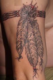 You might be drawn to a feather in an arm band and may choose to add beads to your design. Bannock Oregon Idaho I Love This Tattoo With Like It On My Upper Arm Put Color In The Feathers Feather Tattoos Cherokee Tattoos Indian Tattoo