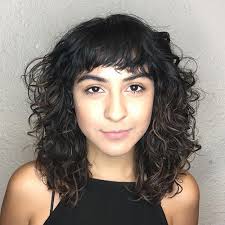 She has hair with natural texture and she always makes sure that her hairstyle compliments her round face and her cheerful personality. 20 Most Incredible Curly Hairstyles With Bangs