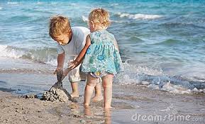 13 beach activities for kids. Two Children Playing On Beach Kids Playing Photography Beach Play Kids Playing