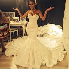 Minimalist mikado silk fit & flare wedding dress, strapless sweetheart neckline, open back, narrow beaded waistband, covered buttons, trumpet style skirt, chapel train. Champagne Colored Mermaid Wedding Dresses Fashion Dresses
