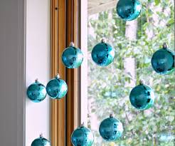 15 Ways To Decorate With Ornaments Not On Your Christmas Tree2 Christmas Window Decorations Diy Christmas Window Christmas Chandelier