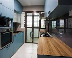 Blue Kitchen Cabinets With A Kompacplus Countertop Interior Design Kitchen Interior Design Sites Interior Design Website