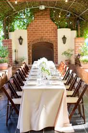Long Tables And Mahogany Folding Chairs Wedding Table Settings Palm Wedding Wedding Chairs